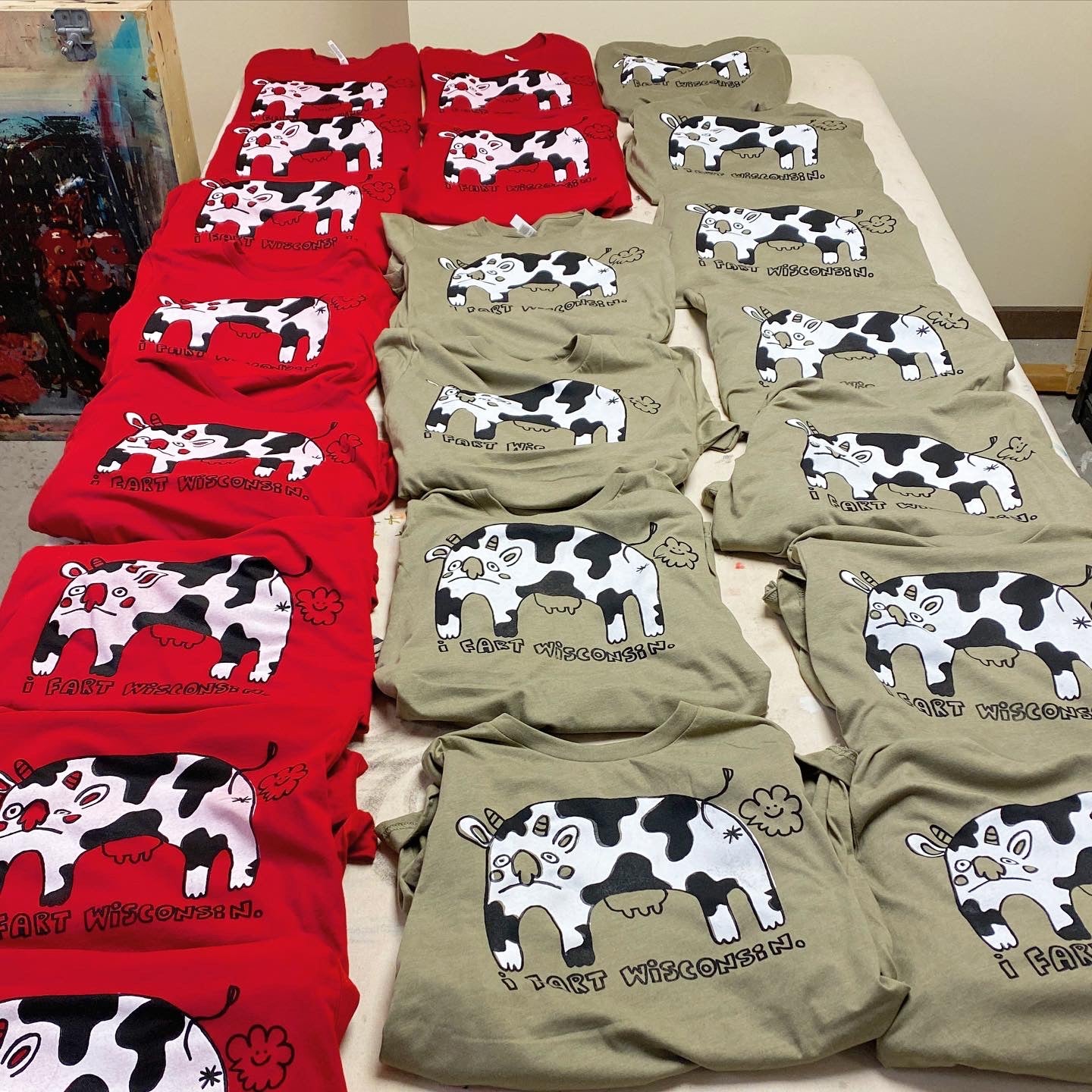 I Fart Wisconsin Farting Cow Illustration Screen Printed Tee | Assorted Colors | Heather Olive, Poppy Red, Strobe Yellow