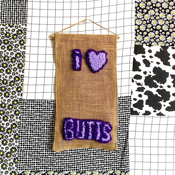 Butts Banner | Assorted Button Display Banner | Needle Punch Rug + Burlap