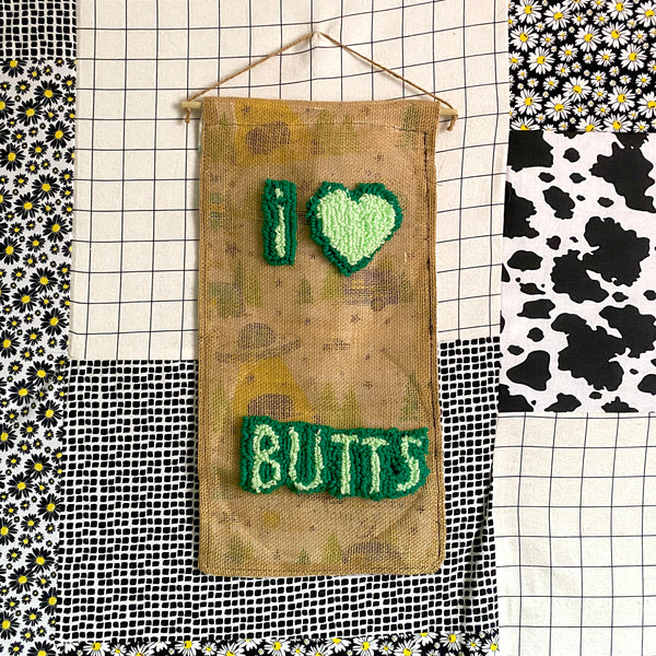 Butts Banner | Assorted Button Display Banner | Needle Punch Rug + Burlap